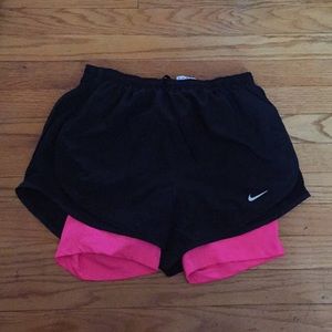 Black  running shorts with a neon pink under short